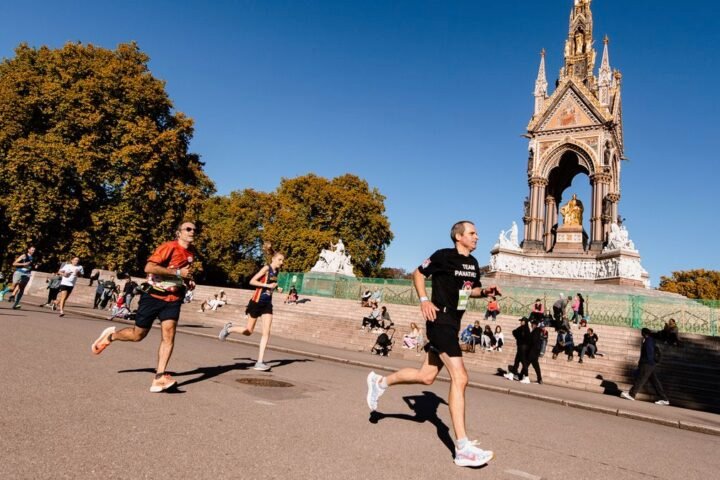 Runners in the Royal Parks Half Marathon run past the Albert Memorial in Kensington Gardens, London